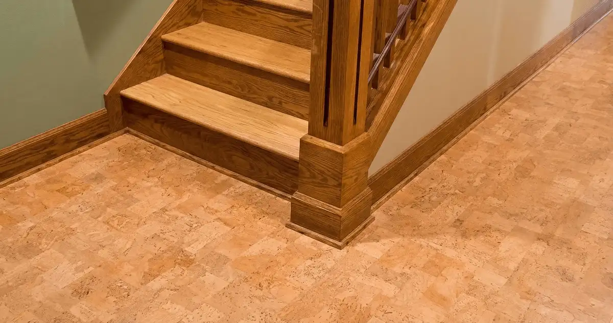 End of a staircase with cork flooring in Austin, TX