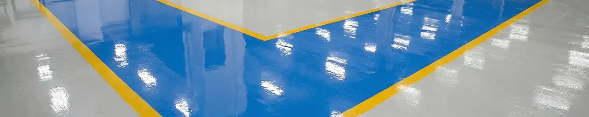 A factory floor professionally covered and marked with epoxy flooring in Austin, TX