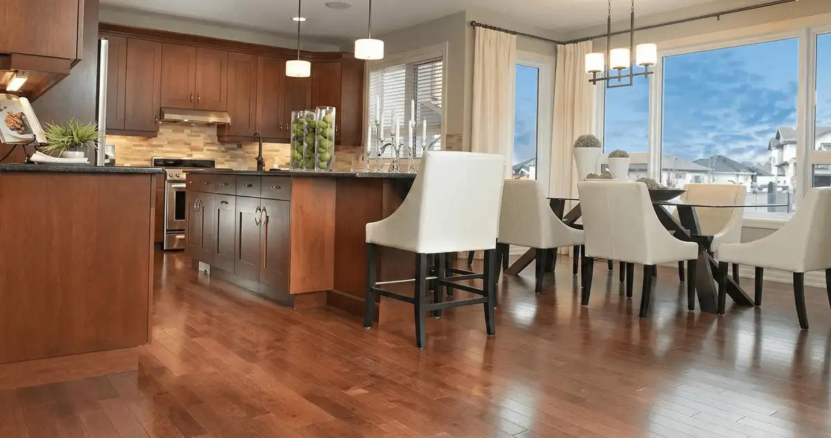 A modern kitchen with professionally installed wood flooring in Austin, TX