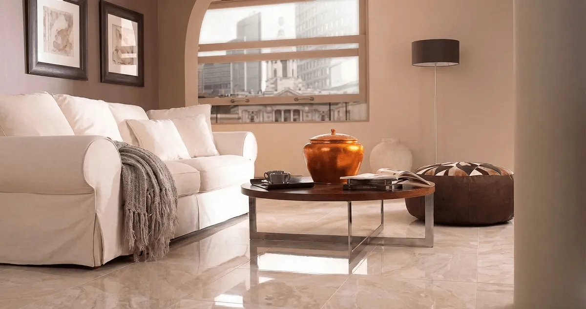 Modern living room with professionally installed marble flooring, a beige sofa, coffee table in Austin, TX