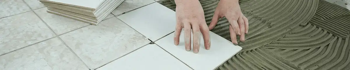 Professional installing white tile floors in Austin, TX