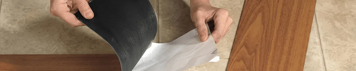 A professional installing vinyl flooring in Austin, TX